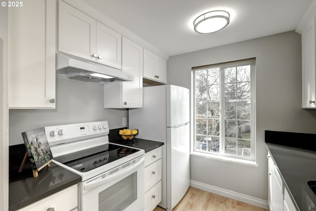 kitchen with white cabinets, white appliances, and light hardwood / wood-style flooring