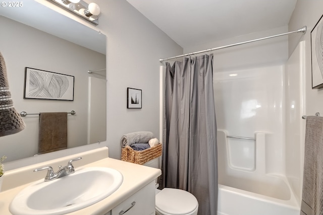 full bathroom featuring vanity, shower / bath combo, and toilet