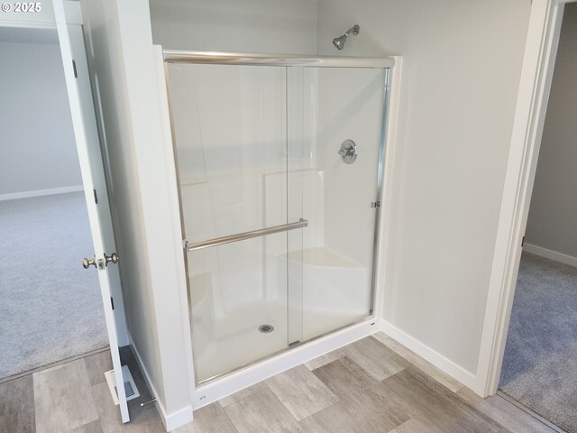 2911 Olympic St Unit 25, Woodburn, OR 97071 - kitchen featuring light wood finished floors, recessed lighting, a fireplace, light countertops, and white cabinetry