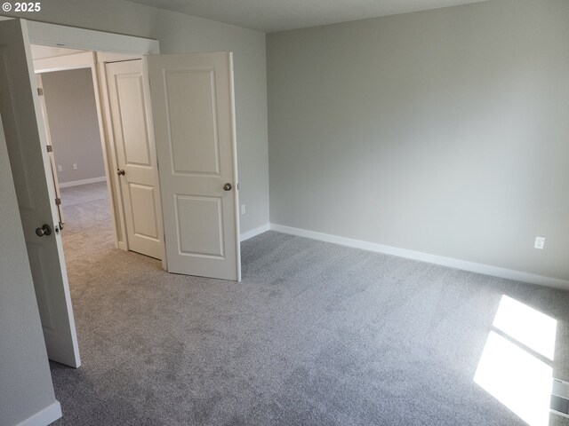 2911 Olympic St Unit 25, Woodburn, OR 97071 - kitchen with light wood finished floors, tasteful backsplash, baseboards, light countertops, and white cabinets