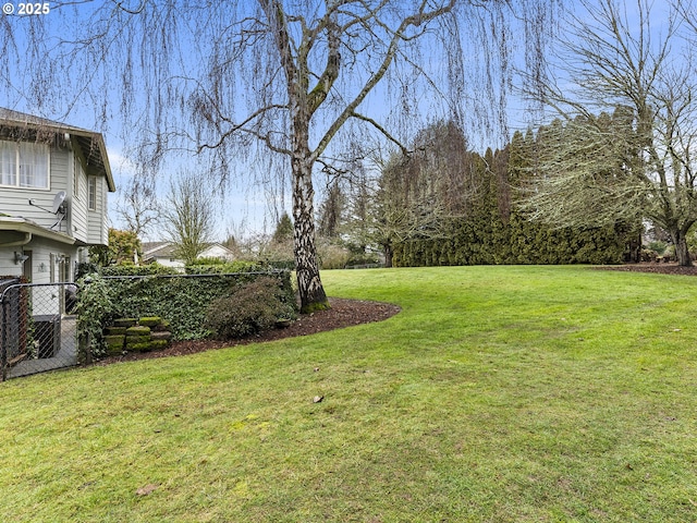 view of yard featuring fence