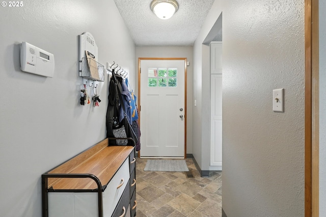 2112 SE 148th Pl, Portland, OR 97233 - doorway with stone finish flooring and a textured ceiling