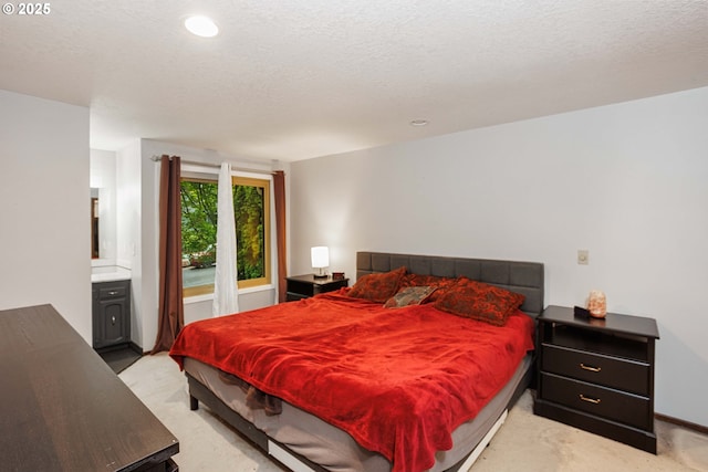 bedroom featuring light carpet, a textured ceiling, recessed lighting, and baseboards