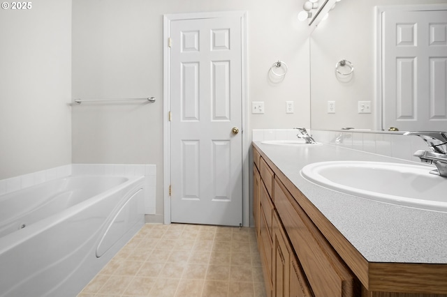 full bath featuring double vanity, a sink, a bath, and tile patterned floors