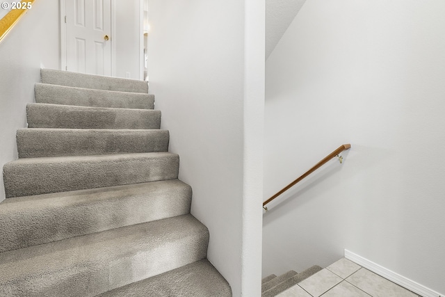 stairs with tile patterned flooring