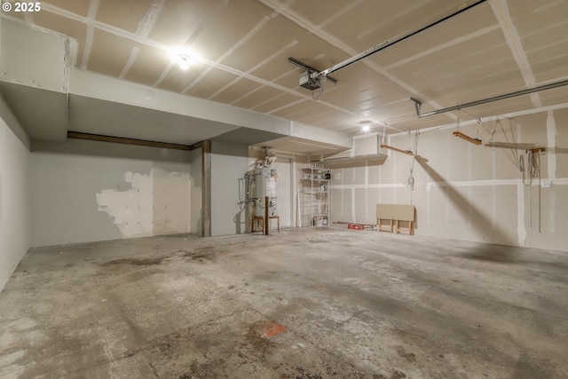 garage featuring a garage door opener and water heater