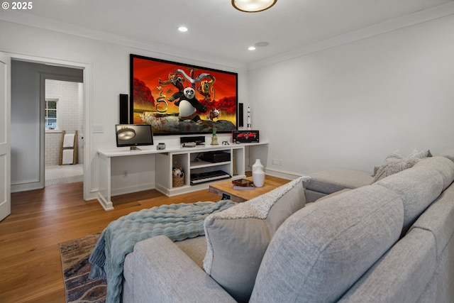 cinema featuring ornamental molding and hardwood / wood-style floors