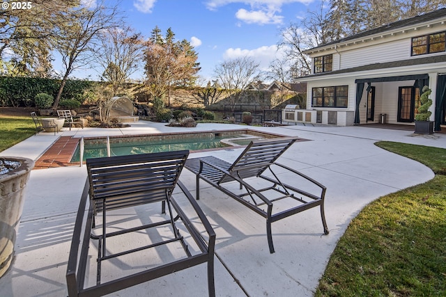 view of patio / terrace with fence and a fenced in pool