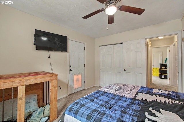 bedroom with carpet flooring, baseboards, ceiling fan, and a closet