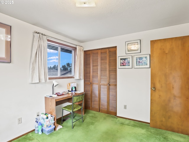 carpeted office with baseboards