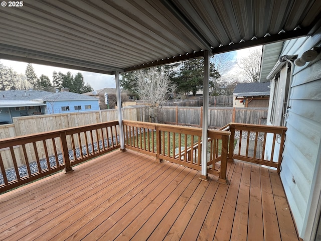 wooden terrace featuring a fenced backyard