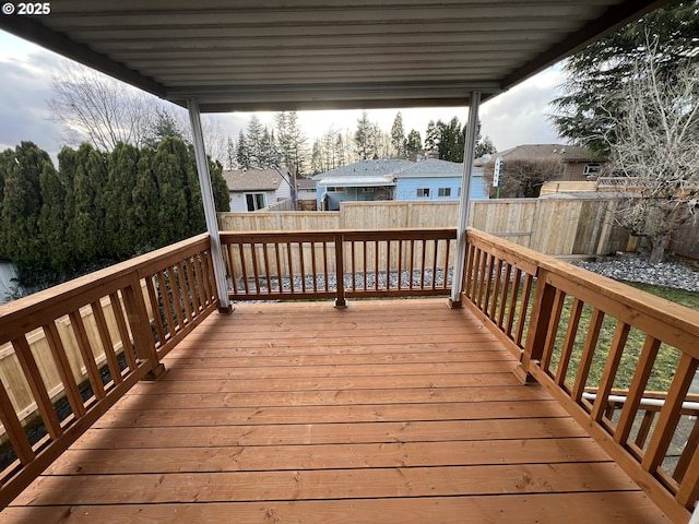 wooden deck featuring fence and a residential view