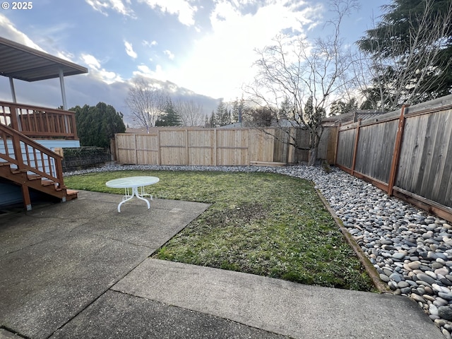 view of yard featuring a patio area and a fenced backyard