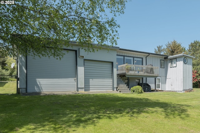 90431 Lewis Rd, Warrenton, OR 97146 - back of property with a garage, a deck, an outdoor structure, stairs, and board and batten siding