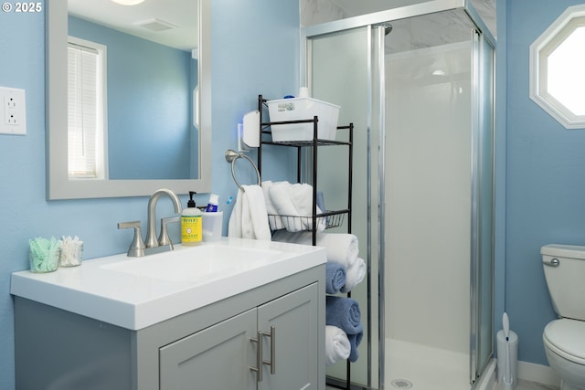 90431 Lewis Rd, Warrenton, OR 97146 - full bathroom featuring toilet, vanity, and a shower stall