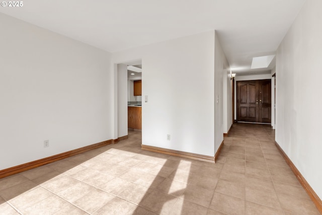 unfurnished room featuring light tile patterned floors