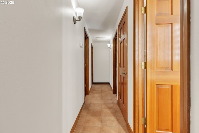 corridor featuring light tile patterned floors