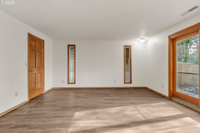 empty room with light wood-type flooring