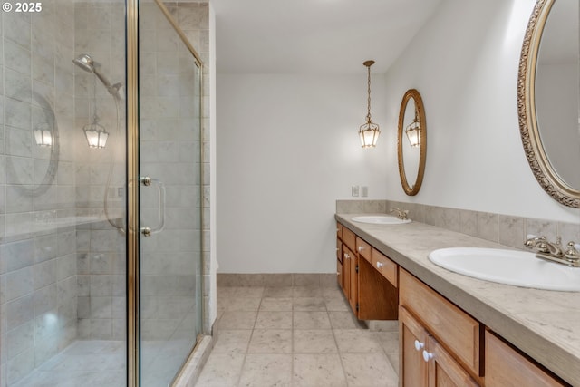 bathroom with walk in shower and vanity