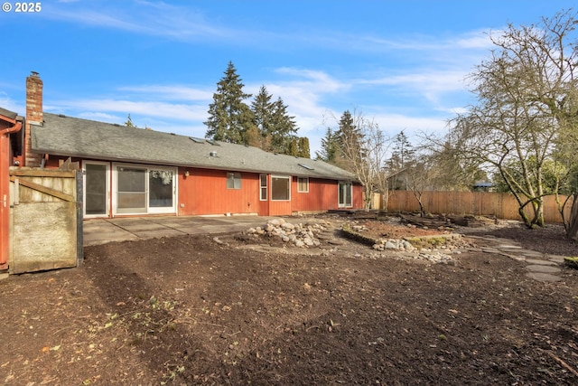 back of property with a patio