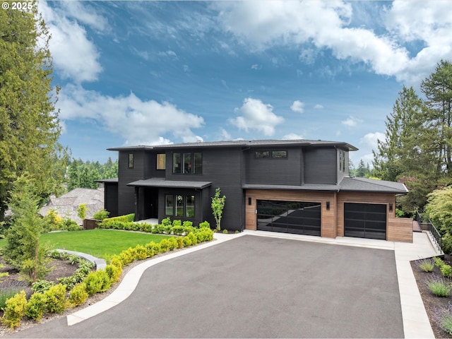 14410 Uplands Dr, Lake Oswego, OR 97034 - contemporary house with an attached garage, asphalt driveway, and a front yard