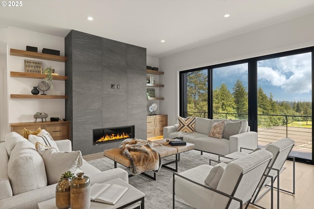14410 Uplands Dr, Lake Oswego, OR 97034 - living room with a fireplace, recessed lighting, and light wood-type flooring