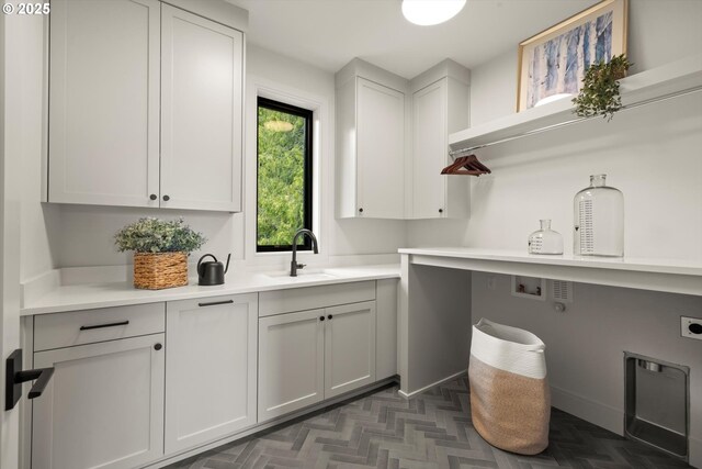 14410 Uplands Dr, Lake Oswego, OR 97034 - laundry room with cabinet space and electric dryer hookup