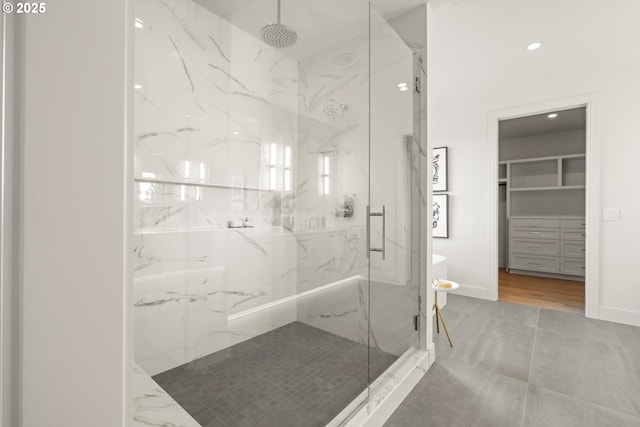 14410 Uplands Dr, Lake Oswego, OR 97034 - bathroom featuring a marble finish shower, a spacious closet, baseboards, and recessed lighting