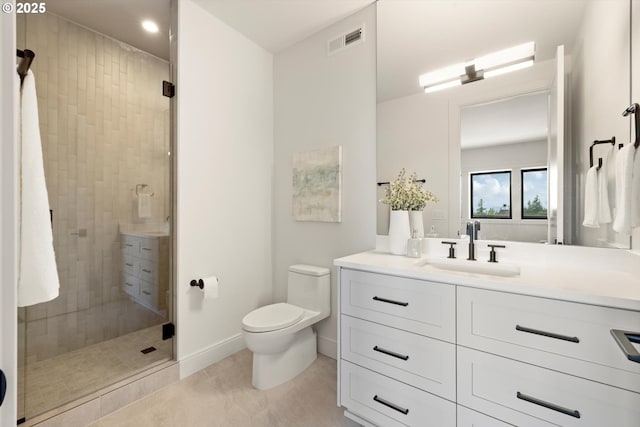 14410 Uplands Dr, Lake Oswego, OR 97034 - full bath with vanity, toilet, tiled shower, tile patterned flooring, and baseboards
