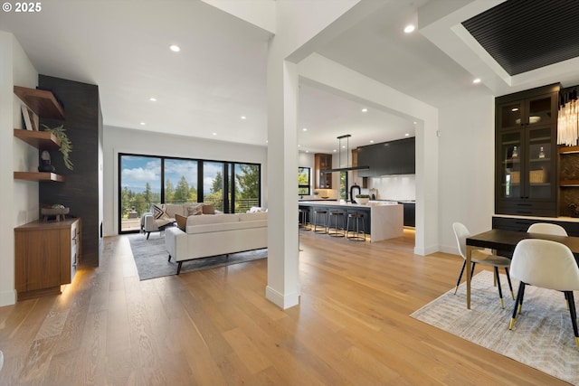 14410 Uplands Dr, Lake Oswego, OR 97034 - living room with light wood-type flooring, recessed lighting, and baseboards