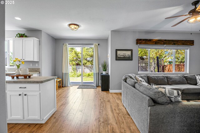 417 W Kemper Crest Dr, Newberg, OR 97132 - living area featuring ceiling fan, light wood-style floors, and baseboards
