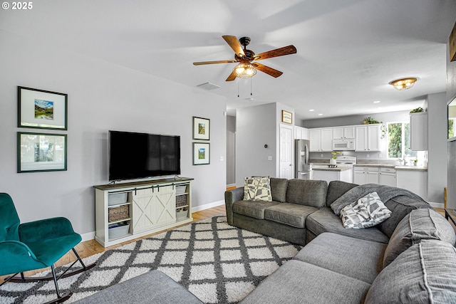 417 W Kemper Crest Dr, Newberg, OR 97132 - living room featuring ceiling fan, baseboards, light wood-style floors, and recessed lighting
