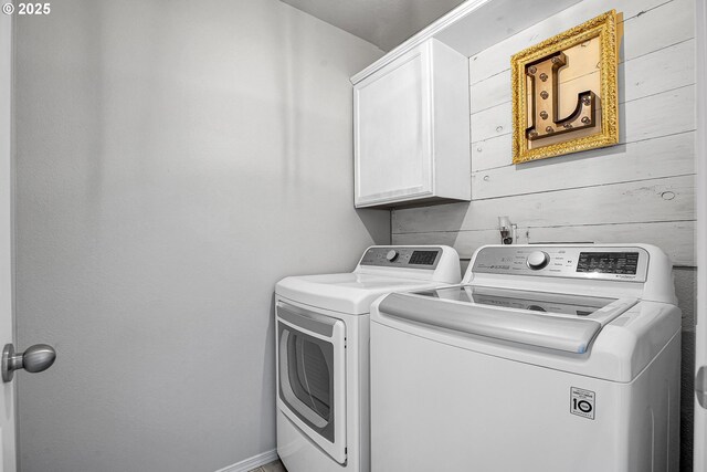 laundry area featuring cabinet space and washer and clothes dryer
