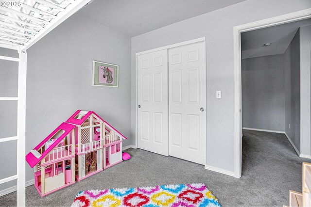 rec room featuring carpet floors and baseboards