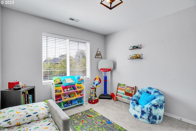 carpeted bedroom with baseboards and visible vents