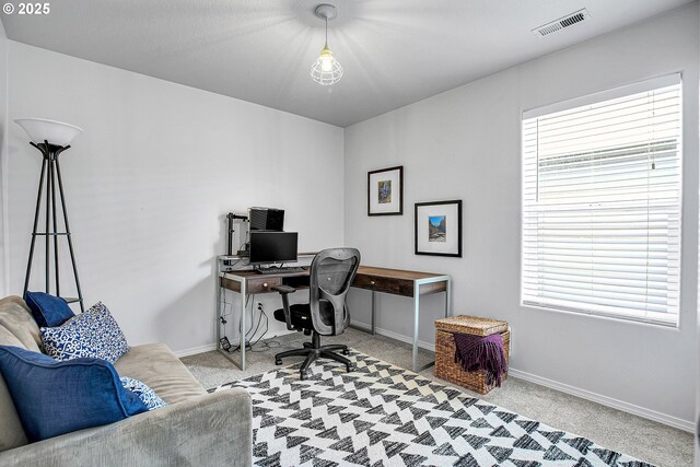 carpeted office featuring baseboards and visible vents