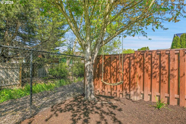 view of gate featuring fence