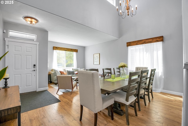 417 W Kemper Crest Dr, Newberg, OR 97132 - dining space with light wood finished floors, baseboards, and a chandelier