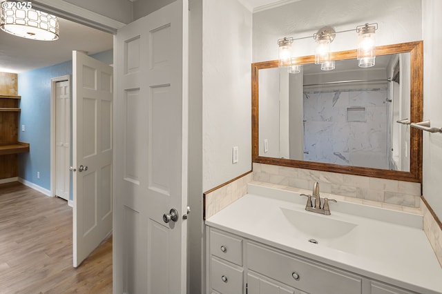 bathroom with vanity and wood finished floors