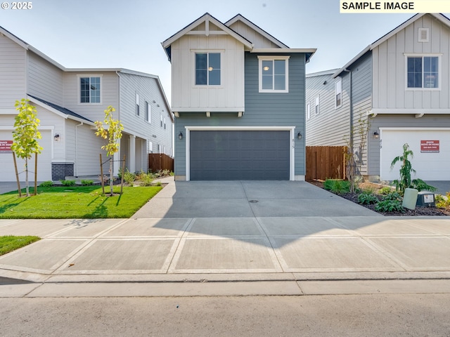 view of front of home featuring a garage and a front yard