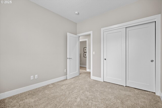 9014 SW Steens Ln, Portland, OR 97225 - unfurnished bedroom with carpet floors, baseboards, and a closet