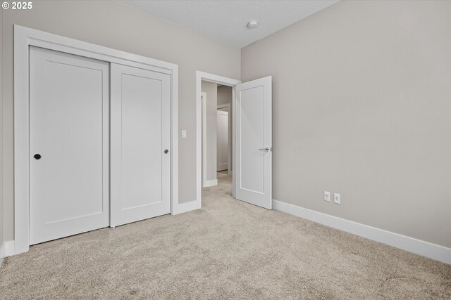 9014 SW Steens Ln, Portland, OR 97225 - unfurnished bedroom featuring carpet, baseboards, and a closet