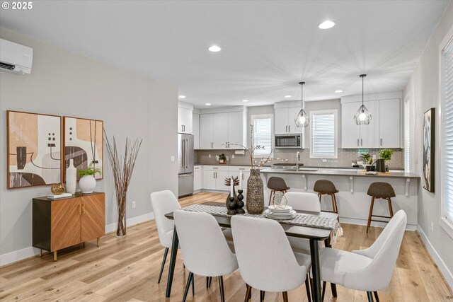 9014 SW Steens Ln, Portland, OR 97225 - dining space featuring light wood-style floors, recessed lighting, baseboards, and a wall mounted AC