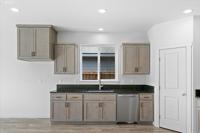 kitchen with dishwasher, recessed lighting, light wood-style floors, and a sink