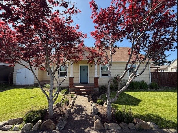 351 Juniper St, Junction City, OR 97448 - view of front of home with a front lawn and fence