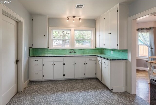 351 Juniper St, Junction City, OR 97448 - kitchen with backsplash, white cabinets, and visible vents