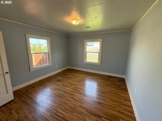 351 Juniper St, Junction City, OR 97448 - unfurnished room with baseboards, visible vents, plenty of natural light, and wood finished floors