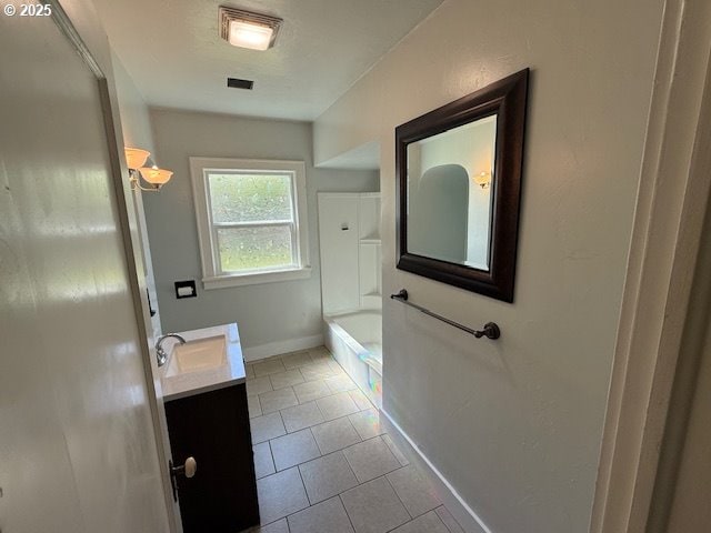 351 Juniper St, Junction City, OR 97448 - bathroom featuring baseboards, visible vents, a bath, tile patterned floors, and vanity