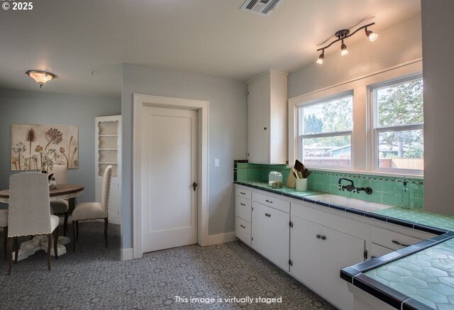 351 Juniper St, Junction City, OR 97448 - dining area with a textured ceiling, arched walkways, and wood finished floors