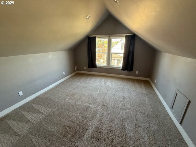351 Juniper St, Junction City, OR 97448 - additional living space featuring visible vents, carpet floors, and vaulted ceiling